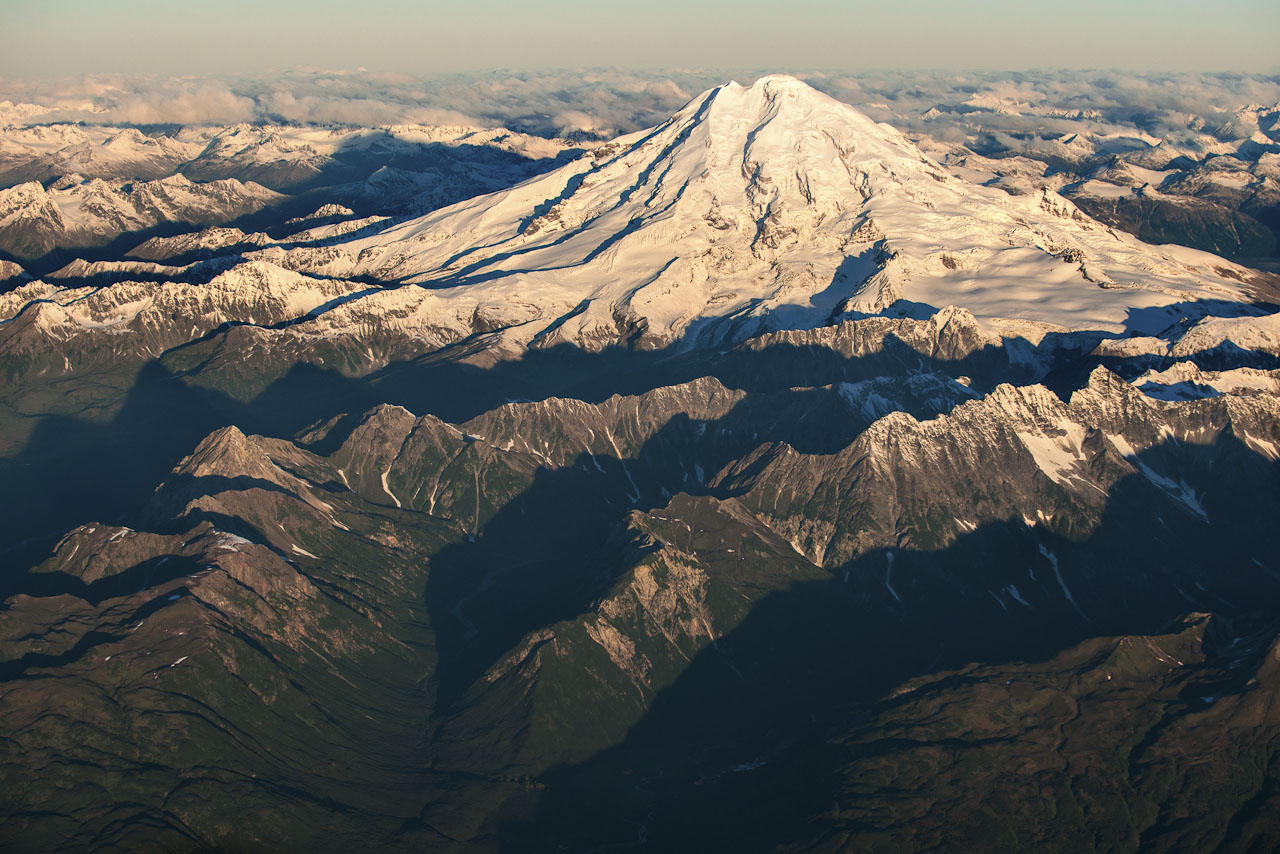 Expansive aerial landscape of valleys and ridgelines