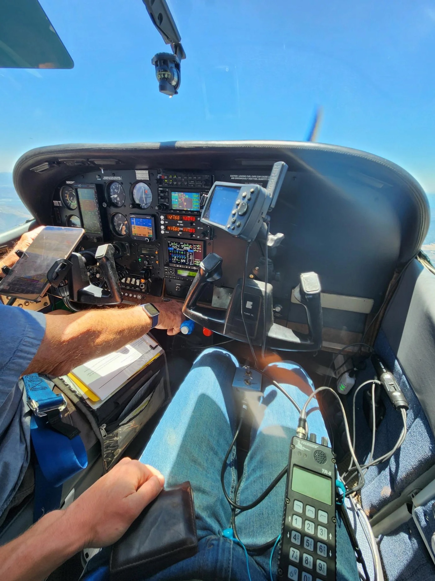 Aerial photographer at work during a conservation flight