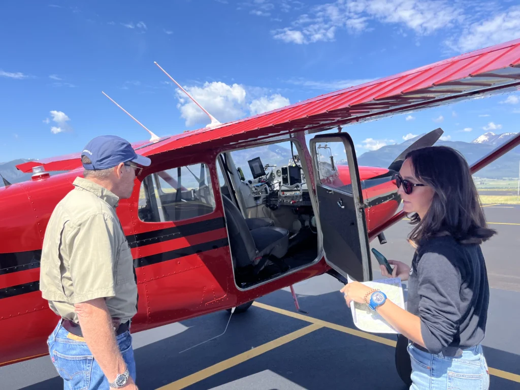 Pilot and passenger by plane - LightHawk