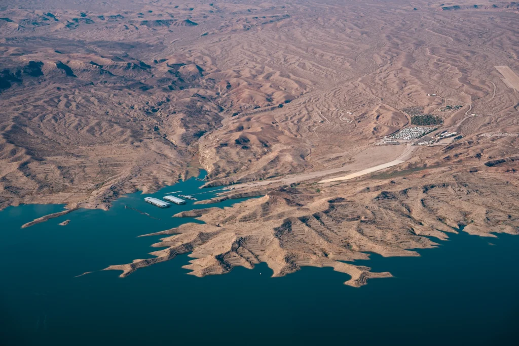 A marina on Lake Powell sits at the end of a long boat ramp that does not reach the water.