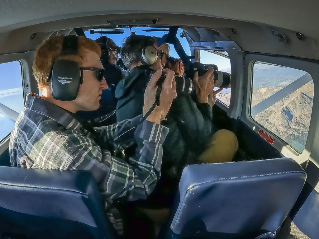 Researchers point cameras out the side of the airplane to capture images of the glaciers below.